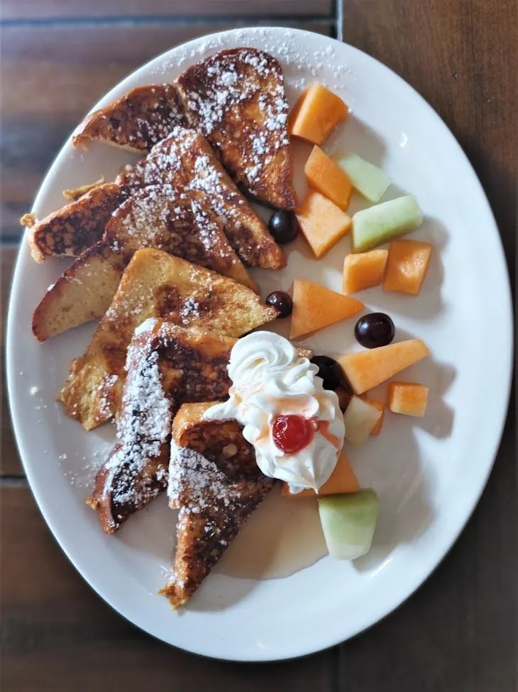 French toast with whipped cream and fresh fruit